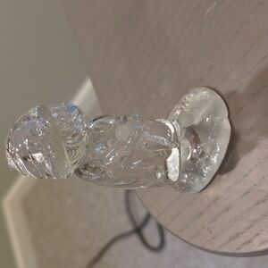 Figurine of little girl holding bird in winter